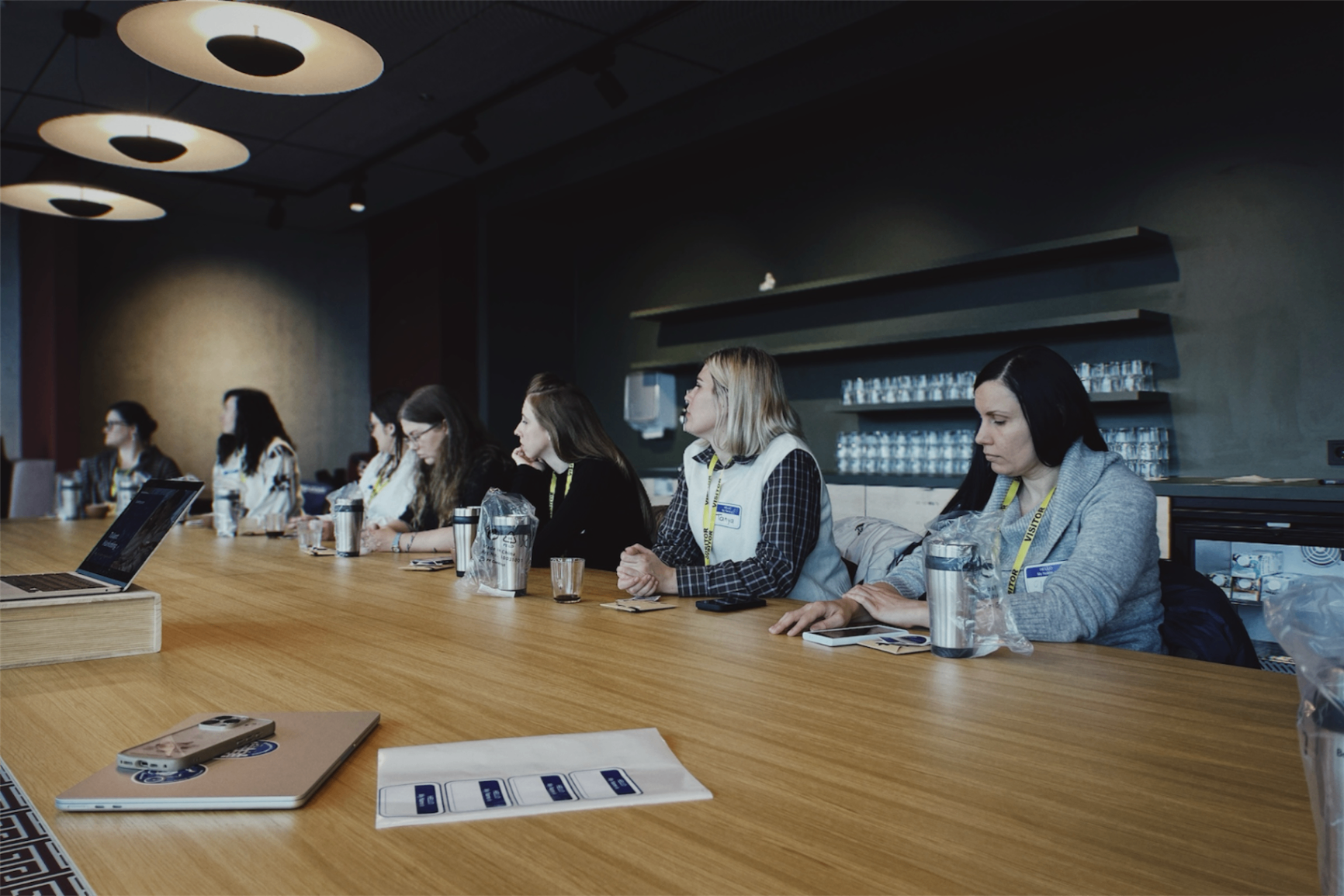 Delegation participants seated around a meeting table during a focused learning session